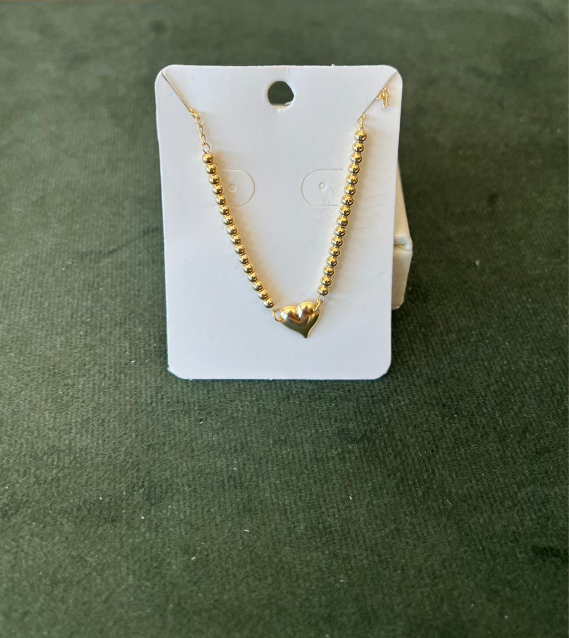Pulseira de coração dourado
