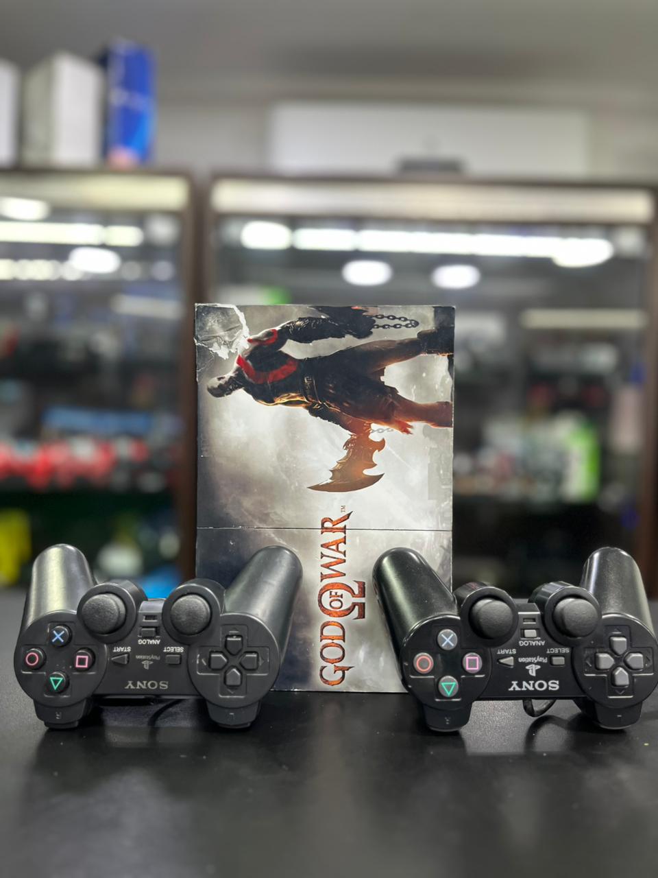 PlayStation 2 Slim Skin God Of War + 2 Controles + Jogos + HDMI | Revisado