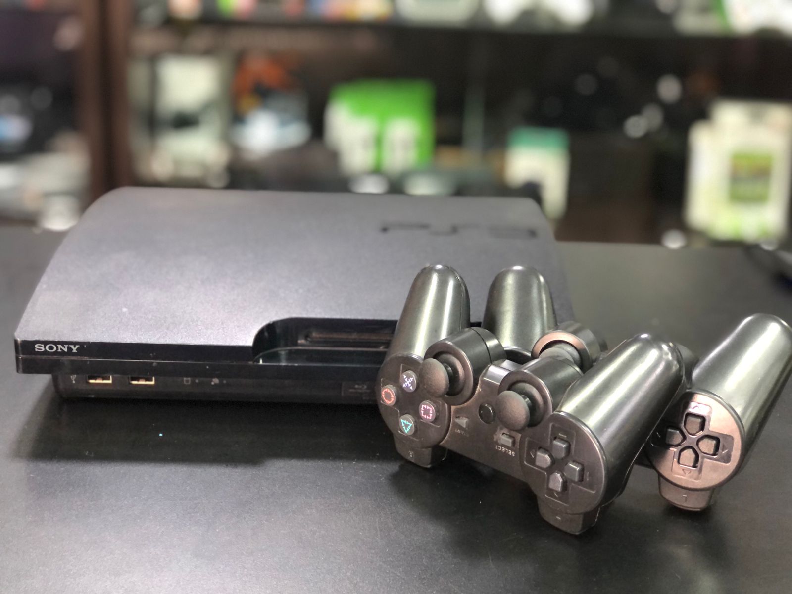 Playstation 3 Slim 750gb Sistema H.e.n + 2 Controles S/Fio Paralelo + Jogos - Item Usado